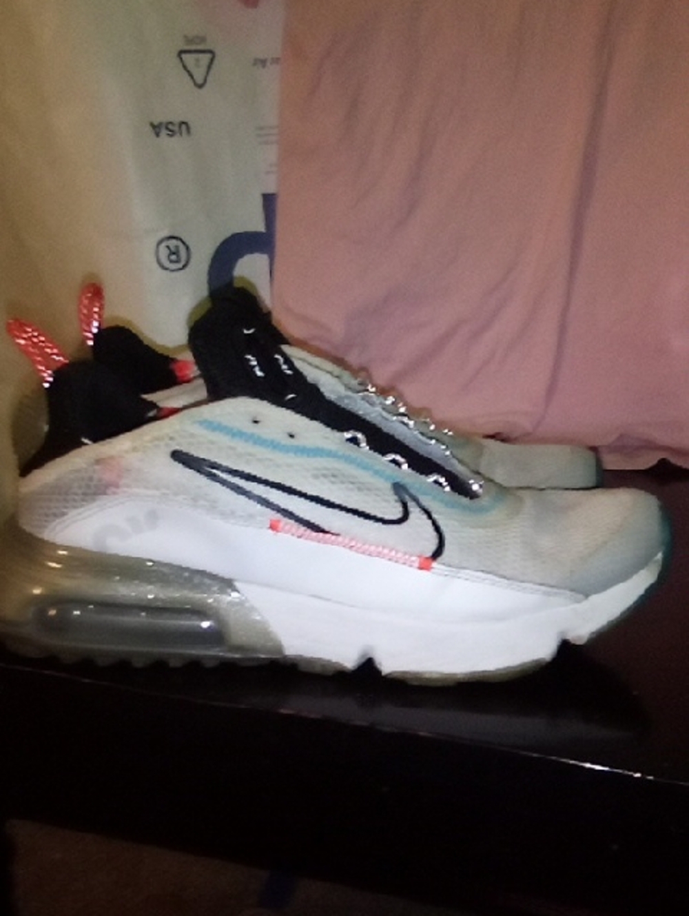 Nike White Sneakers with Light Blue Accents and Black Swoosh